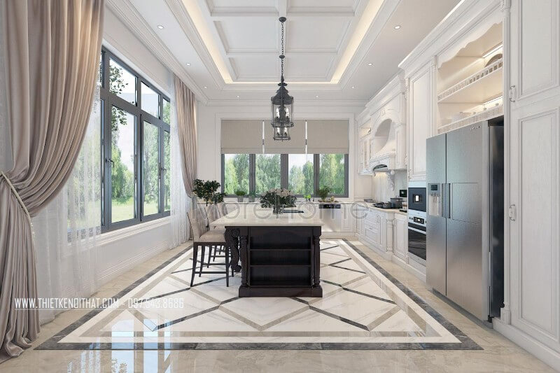 Nội thất phòng bếp gỗ tự nhiên được bố trí hợp lí, bộ tủ bếp hoàng gia kết hợp chiếc bàn đảo chính giữ, tích hợp của nhiều công năng như: bàn ăn phụ, quầy bar... tạo sự thuận tiện cho chủ nhân biệt thự Thiết kế phòng bếp tân cổ điển sang trọng